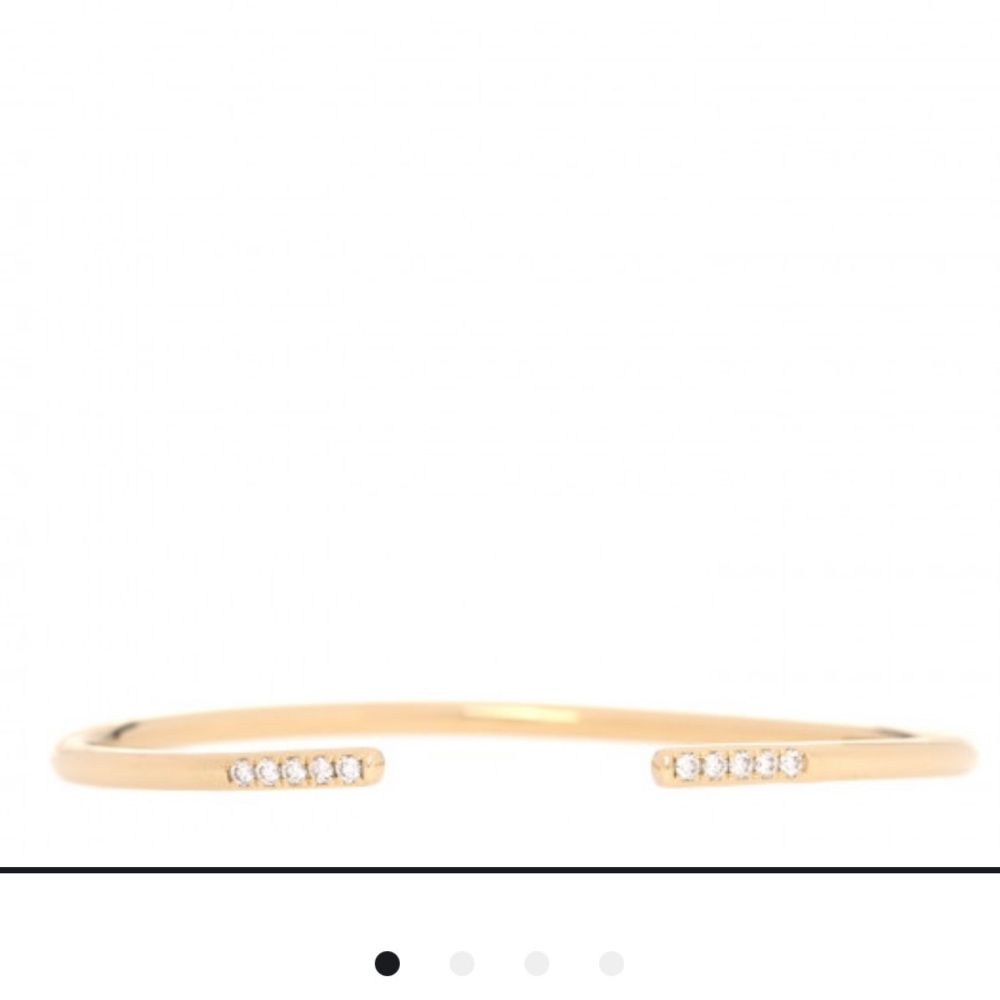 This is an authentic TIFFANY 18K Yellow Gold Diamond Metro Wire Bracelet.